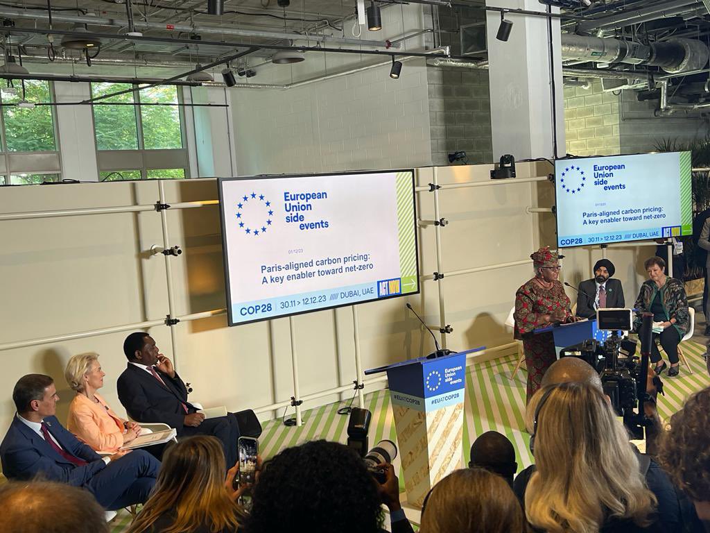 NOIweala's tweet photo. At COP28 in Dubai, at an EU Forum on “Paris Aligned Carbon Pricing: A Key Enabler Toward Net Zero”. With their Excellencies, President of the European Commission @vonderleyen, President @HHichilema of Zambia, Prime Minister @sanchezcastejon of Spain, @KGeorgieva IMF MD, and Ajay Banga @WorldBank President. Focusing on coordinated approaches to carbon pricing and voluntary carbon markets, including how a portion of revenues from these approaches can be used to support developing countries in a just transition. Also mentioned the international organisation Task Force to harmonise carbon pricing approaches comprised of @WTO, @IMF, @WorldBank, @OECD and UN organizations.