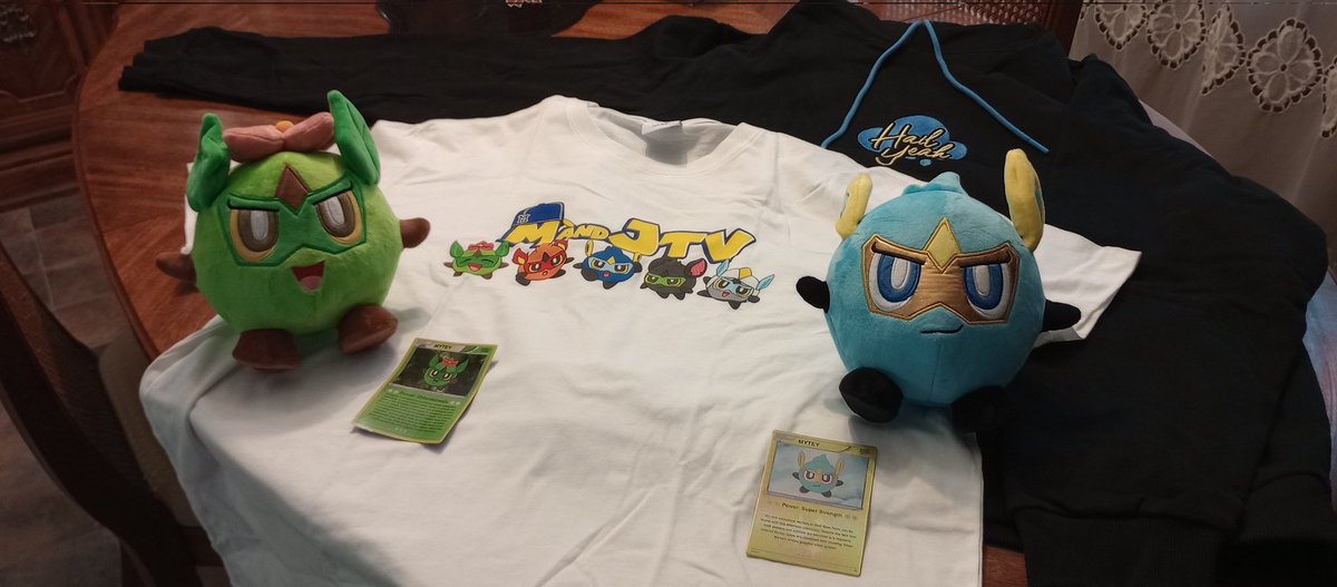 LadyCygnus2112's tweet photo. @MandJTV_Michael Just got these in the mail today and oh my God the plushies are so adorable 🥰 I wanted the shiny Mytey because not long after I had watched the 'I Fused Pokémon as Team Sky' video I caught my first ever shiny pokémon. I love everything I got. Well done Mikey. https://t.co/VSBSTygeDE