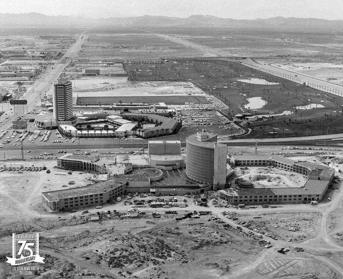 The @LVNewsBureau took to the air in March 1966 to check the construction progress of Caesars Palace #LasVegas . The Dunes and country club in the background...and a whole lot of empty desert.