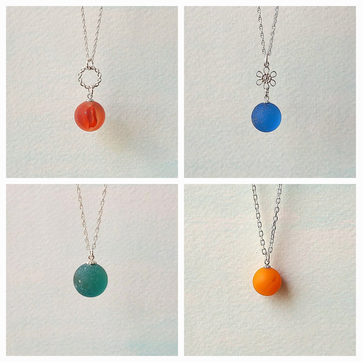 20% SALE! Some genuine #seaglassmarble & #sterlingsilvernecklaces: A red #seaglass marble & #wreath; #cornflowerseaglass marble & #flower; a #tealseaglass marble; rare #orangeseaglass marble. etsy.com/shop/SaltyLass… #seaglassjewelry #genuineseaglass #seaglassnecklace #redseaglass