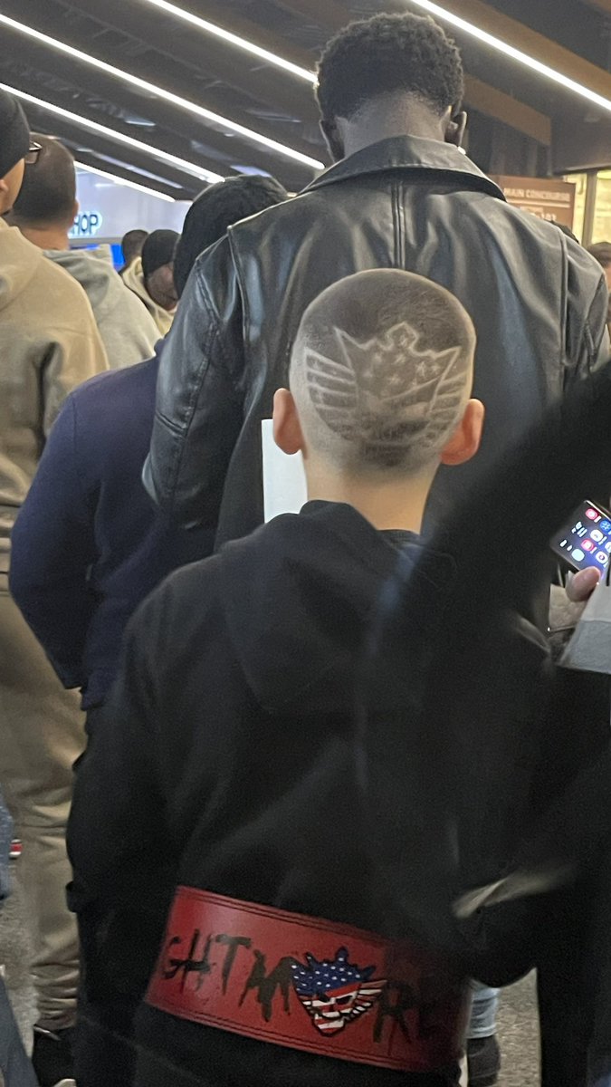Matmenpodcast's tweet photo. Guy has haircut with son he has yeah his son has Codys logo #SmackDown https://t.co/chqr08OruH