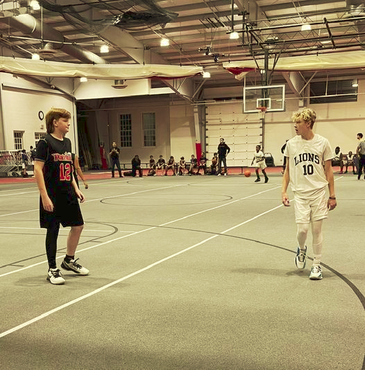 revmahoney's tweet photo. My grandson Asa, in the white uniform, had an incredible first game of his school basketball career. He also followed a Mahoney Tradition. That is, "Never be dominated by a person with a mullet!" #BasketballRevolution #HoopDreams #LionsBaby #Mullet https://t.co/eWUN4g7T11