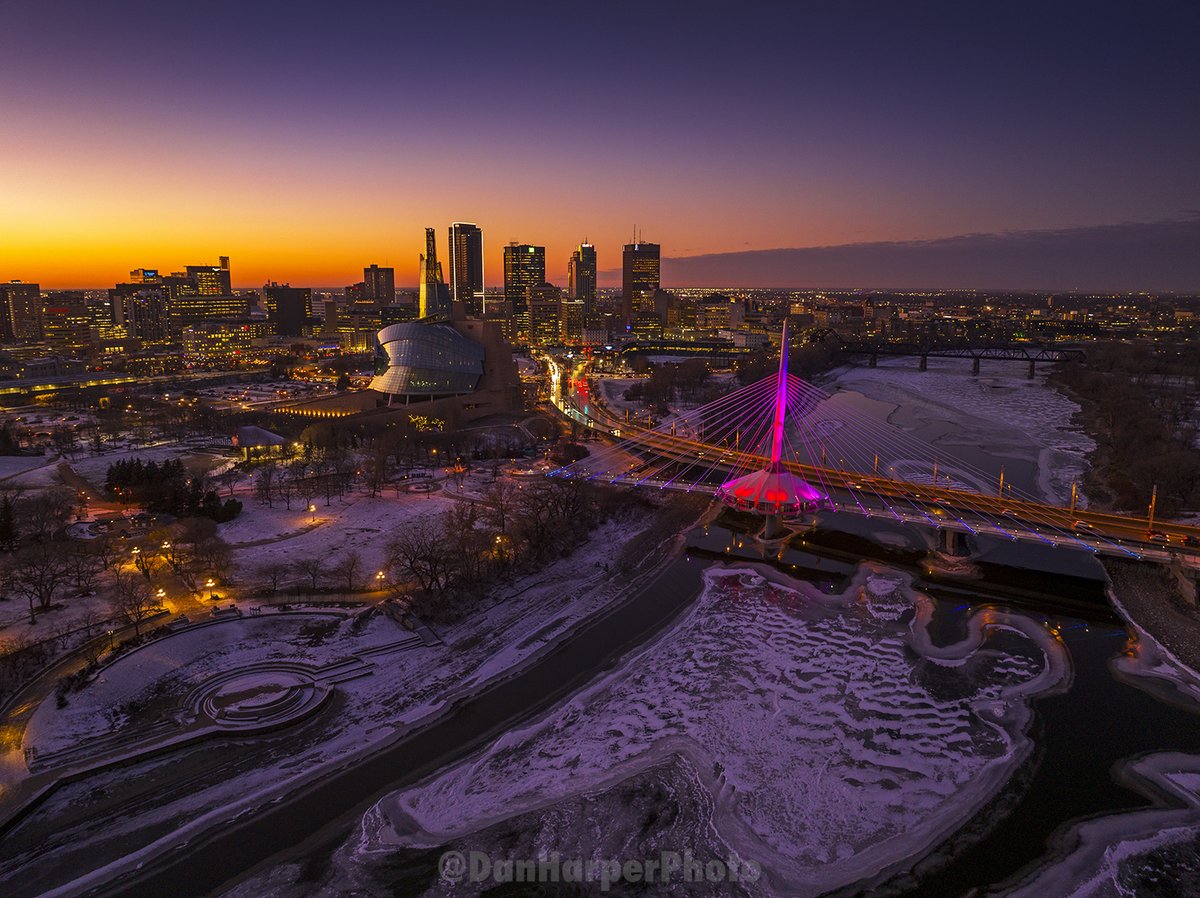 Spectacular #sunset with the rivers freezing over near #TheForks #DowntownWinnipeg the #CMHR in #Winnipeg #ProvencherBridge #WinnipegPhotographer #Drone #OnlyInThePeg #RPAS #LicensedDronePilot #MeetMeAtTheForks