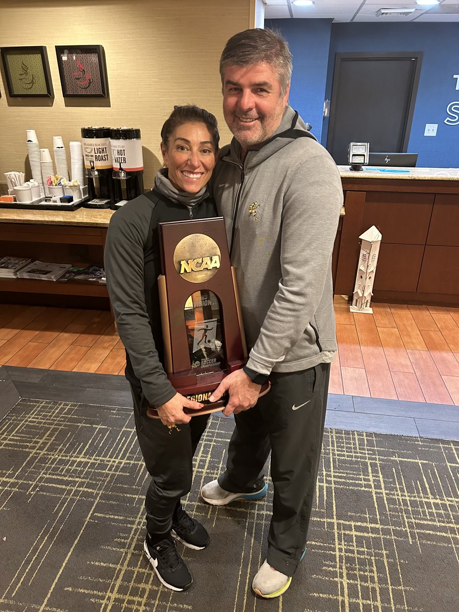 GUKnights's tweet photo. This is a photo every Gannon fan will love to see: GU's Soccer Coaching Super Couple, Colin and Lia Petersen, hold the Atlantic Regional title trophy after the women's soccer team's historic win over West Chester on Friday.  They deserve this ... and more!
@GannonU https://t.co/rEKV9Elbcf