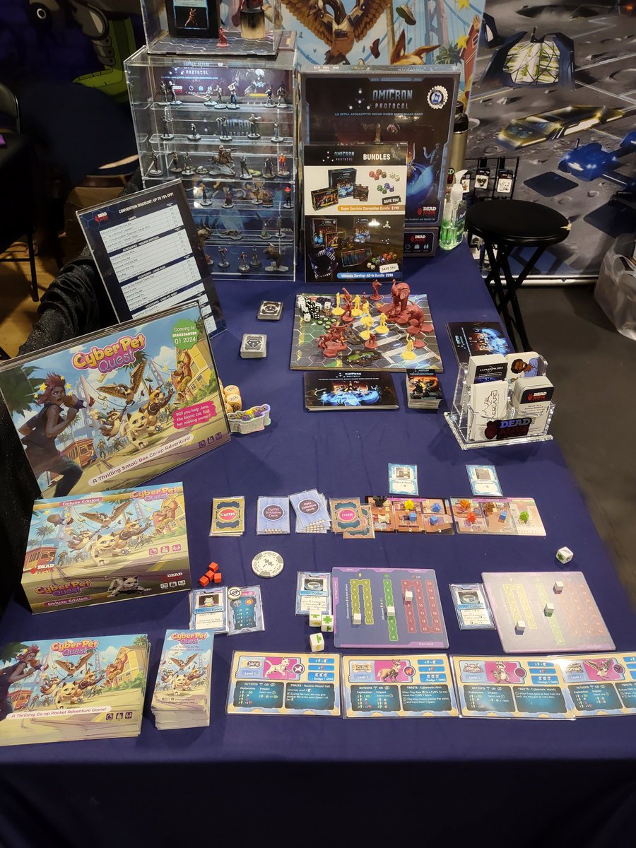 deadalivegames's tweet photo. Rearranging the booth a little bit for more open space and better focus on Lunar Rush. How do you like it? #paxunplugged #paxunplugged2023 #deadalivegames #lunarrush #omicronprotocol #cyberpetquest https://t.co/svODBk7cP4