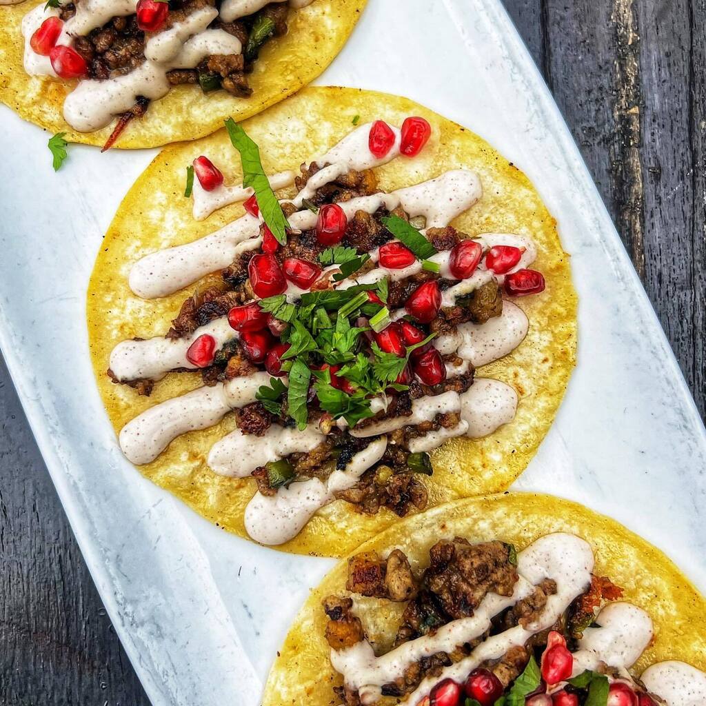 Back by popular demand … Taco en Nogada ❣️ 

En nogada Tacos are mixed meat bathed in nogada, a pecan cream sauce and garnished with pomegranate seeds and cilantro. It is a festive dish because the colors of the dish are said to resemble the colors o… instagr.am/p/C0W9VawrzS0/