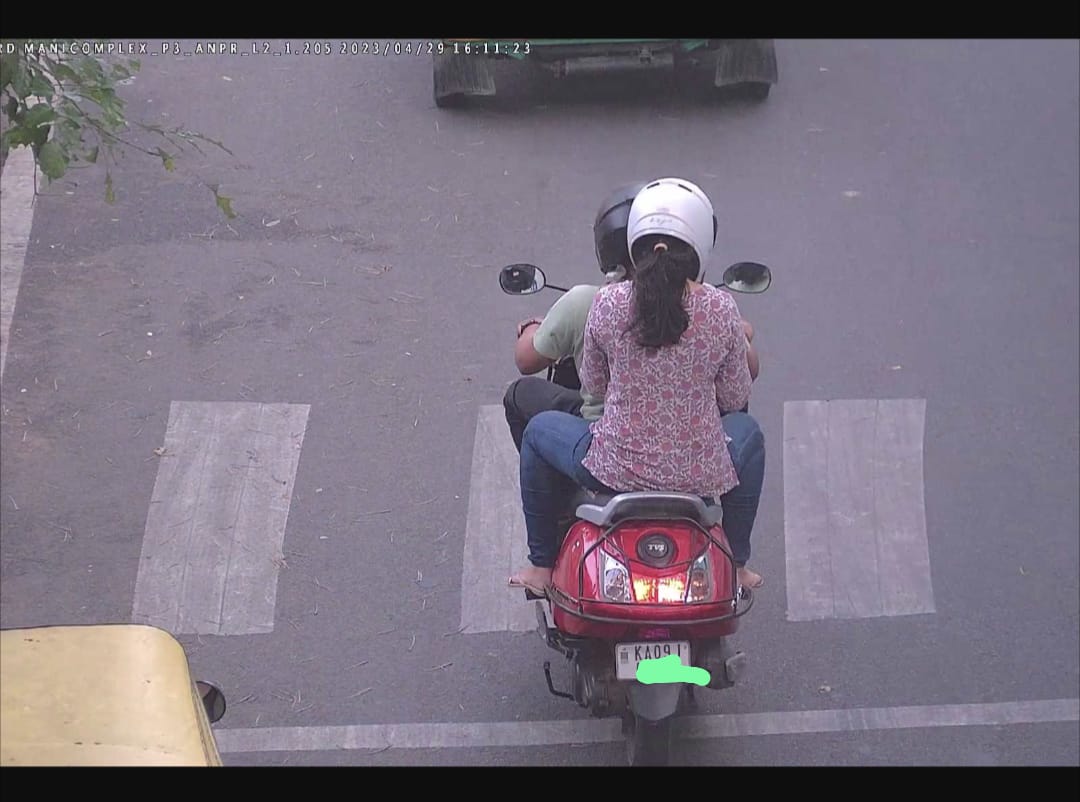 mvivekc's tweet photo. @blrcitytraffic I've been sent a fine despite both rider and pillion wearing helmet. How do I get this rectified?. You can check the image attached with the notice number. https://t.co/N573FrnBdA