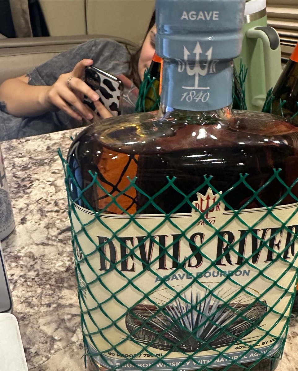 BriBagwell's tweet photo. Had a big week, and The Banned bought me my favorite whiskey and a disco ball to celebrate. I rarely forget to pack the heavenly nectar that is @DevilsRWhiskey, so this was the best gift. Y’all seriously have to try the agave if you haven’t yet… 🌵🥃#sinresponsibly https://t.co/YH4hAdMFqm