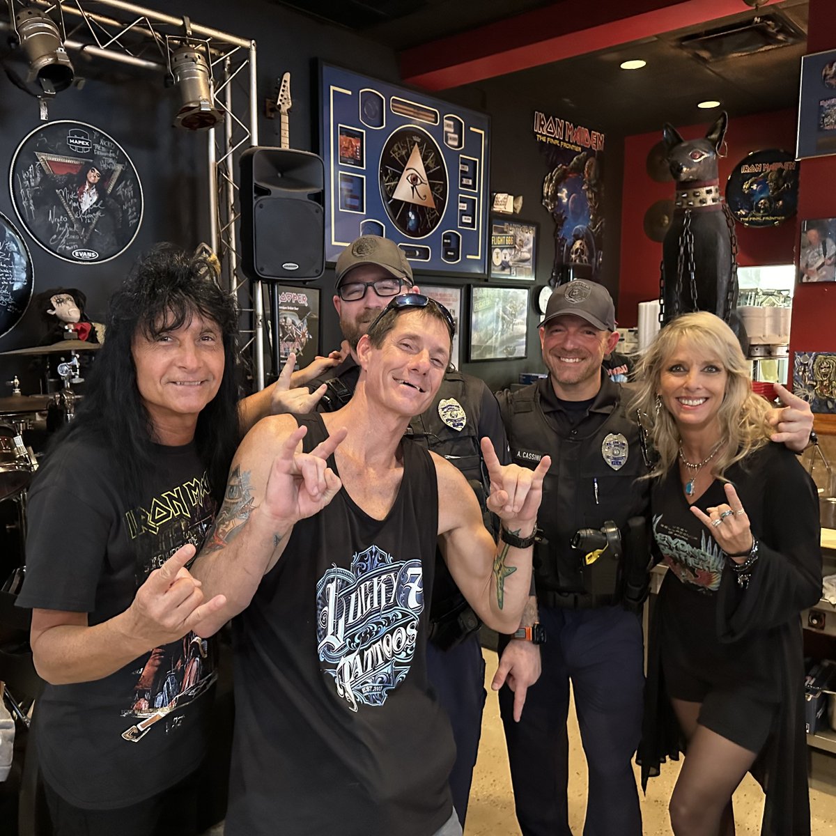 Earlier today at the 14th Anniversary Party of Rock n Roll Ribs, Jason Cushing made a generous donation of $500.00 to St Jude's Research and gets to have dinner with my wife Krista and myself!  We also appreciate the two police officers in the photo, and all that they do!