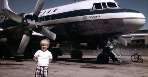 ABoolman25355's tweet photo. Brian Aerni’s son perfectly recreated his father’s 1976 pose – and his parents successfully found some plaid trousers that resembled his father’s 1970s pair.

Brian Aerni’s favorite photo of himself was taken when he was just three years old.

It was 1976. Aerni was living in Denver, Colorado, where his father worked as a station agent at Stapleton International Airport – then Denver’s aviation hub. Young Aerni was obsessed with airplanes and in awe of his father’s airport job. Even as a small kid, he loved tagging along with his dad to work and watching aircraft take off and land.