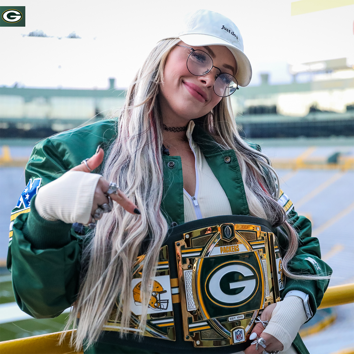 packers's tweet photo. .@WWE Superstar @YaOnlyLivvOnce is here! 

Liv Morgan took a tour of @LambeauField &amp; surprised @Showtyme_33 with a #Packers WWE Legacy Title Belt. 🏆 

More photos 📸: https://t.co/zZdLY46bTi 

#GoPackGo https://t.co/rlyUA6UWjb