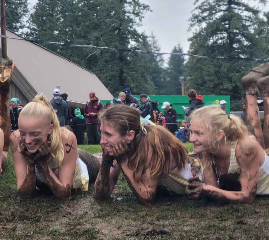 All three Indiana girls that qualified as individuals enjoy the mud after the 2023 NXN National Championships.