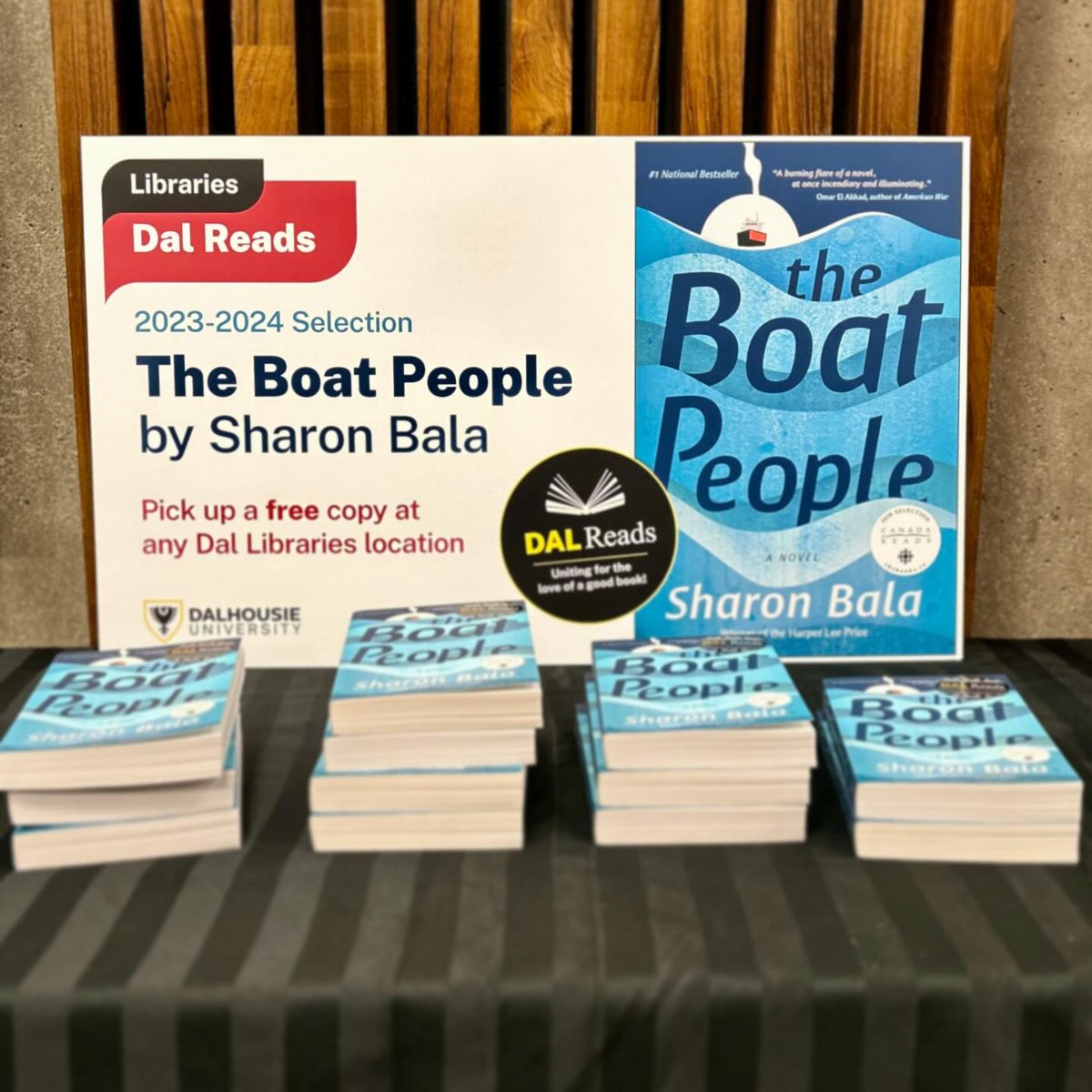 DalhousieU's tweet photo. Find a copy of The Boat People at a Dal library location near you; it's a great read for the holiday break. Follow @DalLibraries for #DalReads engagement opportunities in the new year, including an in-person author reading with Sharon Bala. https://t.co/278QAfUkJs