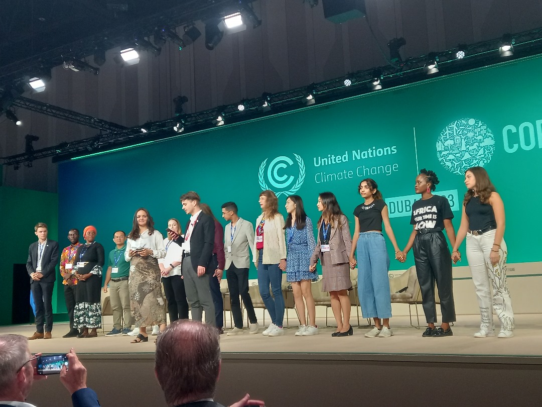 At #COP28, “If all different stakeholders move from a call to action to real ACTION, together, hand in hand, we can transform food systems, nature, and the climate”
<a href="/youngo_unfccc/">YOUNGO</a> delivering the global youth statement at a mainstage event on “Accelerating Food Systems
