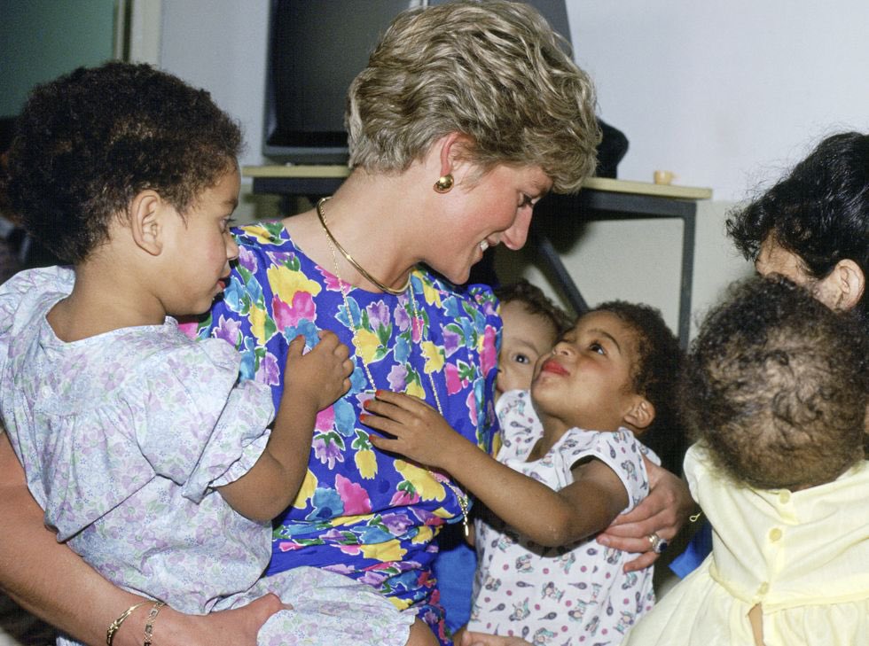 ShawnSeipler's tweet photo. A historic example of #love. Princess Diana pictured in Africa holding babies and children born with AIDS. #LoveServeImpact https://t.co/HcaFt7zjYf