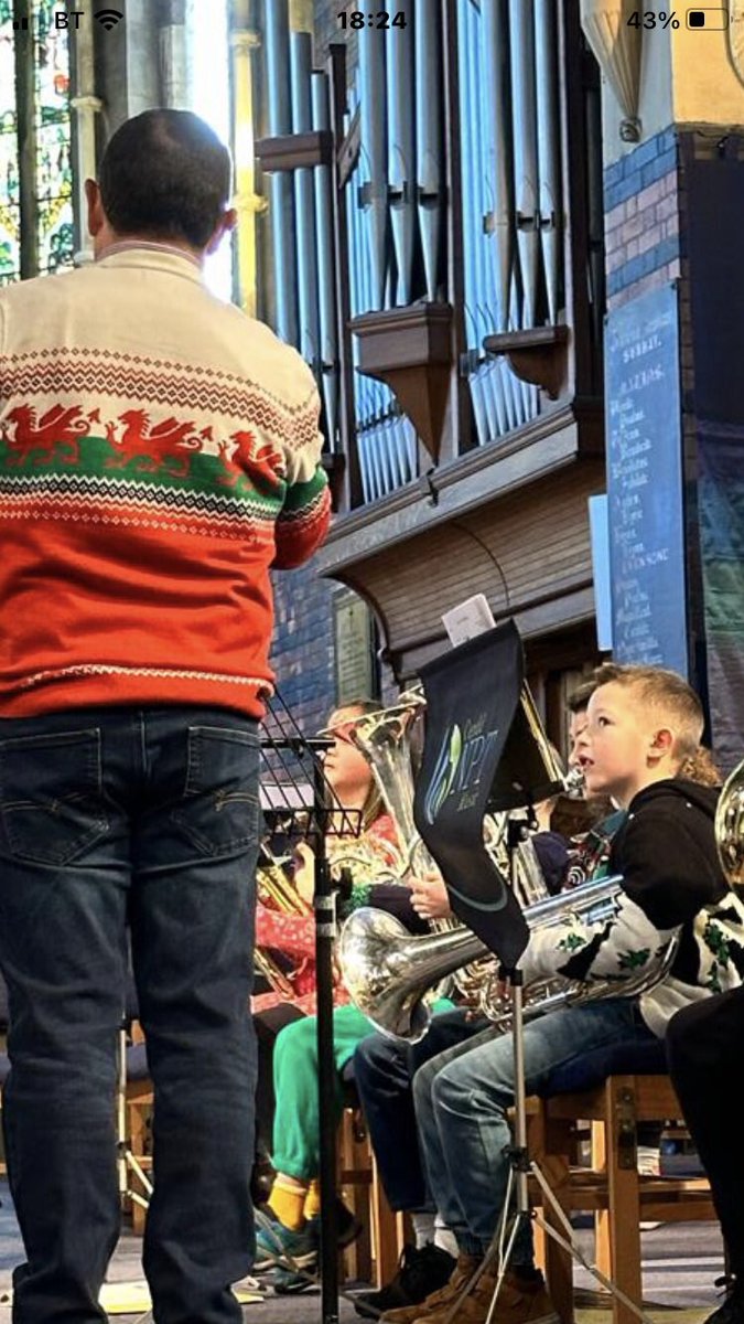 Love this photo of my grandson listening before I conduct the County Training Brass Band ❤️