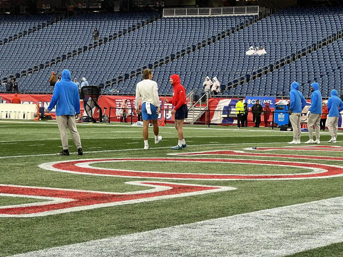 Justin Herbert and Brenden Schooler connect on the field during pre-game.