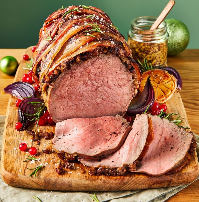 MorfaSP's tweet image. Not a fan of Turkey? @morrisons have you covered. Impress your guests with Beef in a Blanket - Morrisons beef joint coated in a cranberry, stuffing, chive, and wholegrain mustard blanket and wrapped in crispy bacon - yum 😋