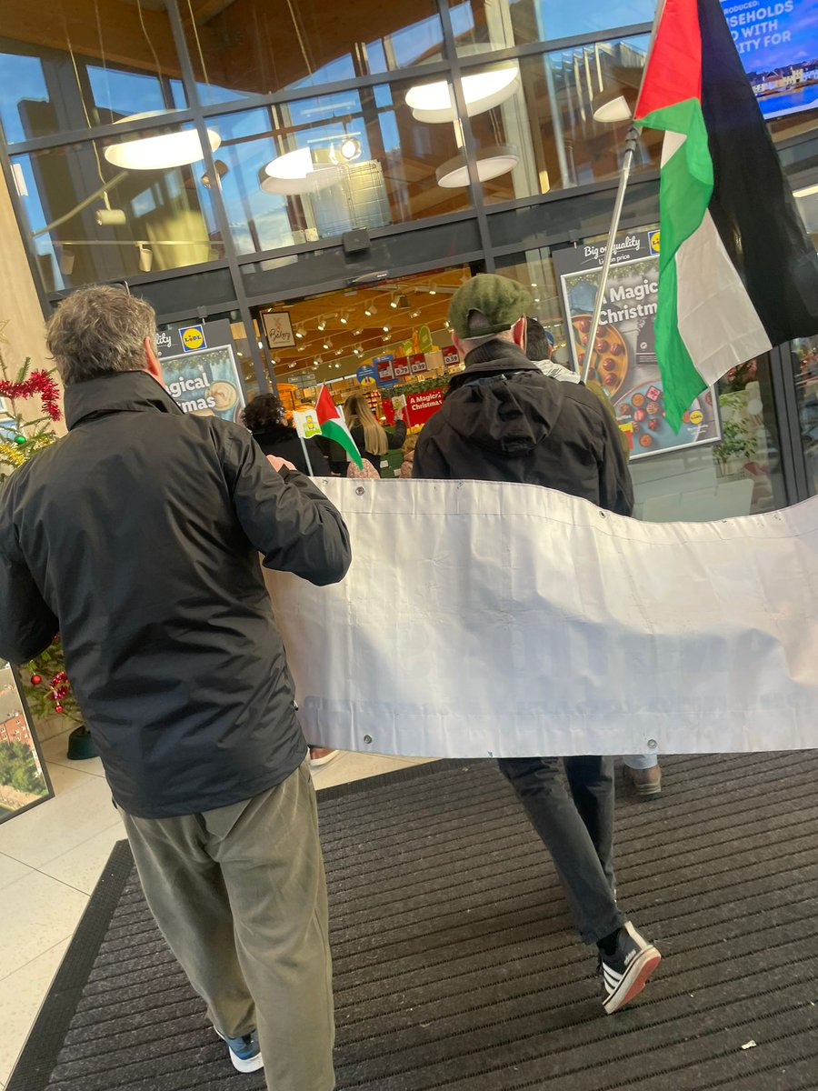 LasairDhearg's tweet photo. Lasair Dhearg activists today attended a protest at Lidl in Andersonstown organised by BDS Belfast. Leaflets informed people of products sold by Lidl that are produced in occupied territories. Customers were asked to sticker these products and later take them from shelves. https://t.co/uc1fXWWjeX