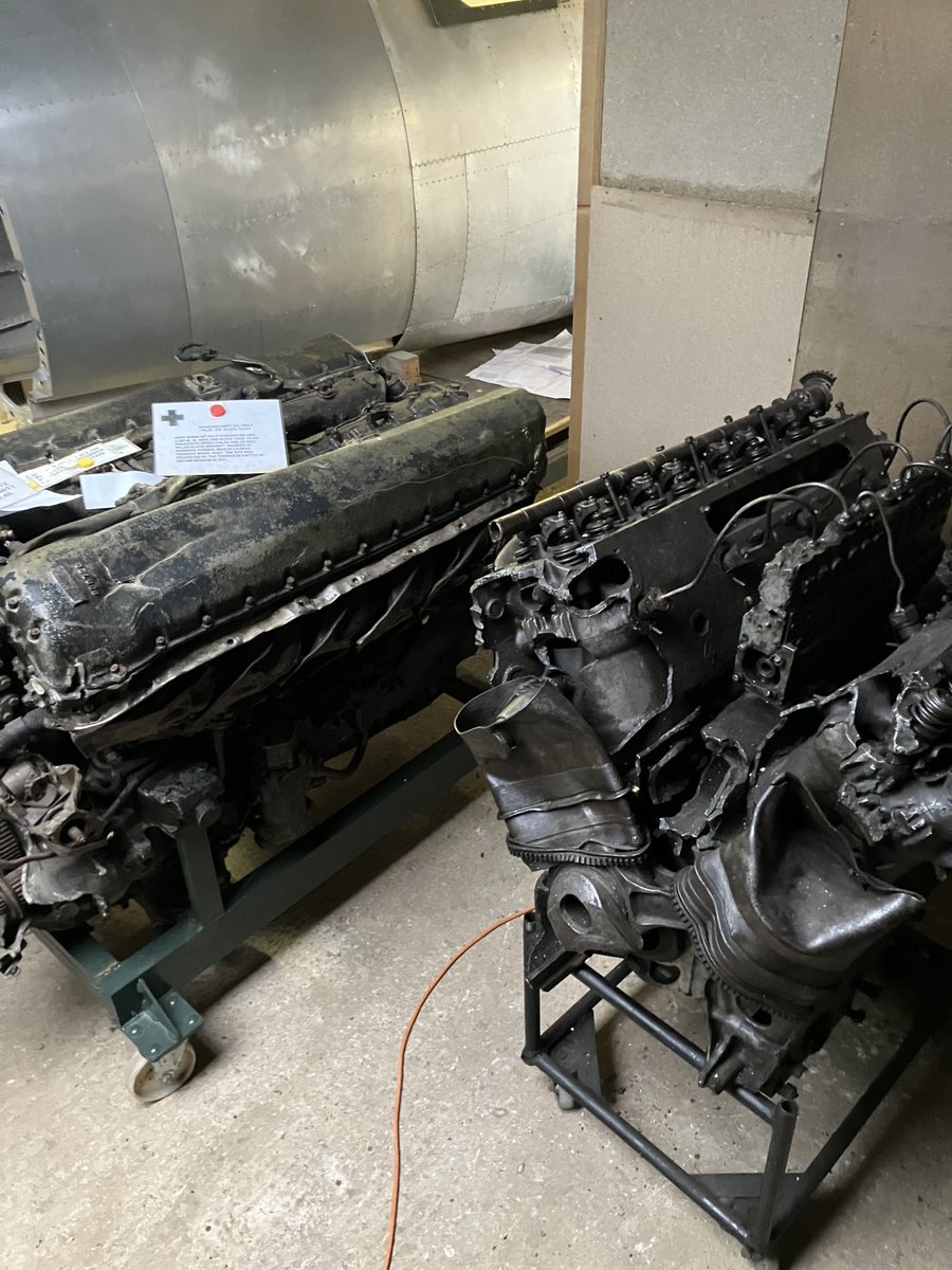Nice bit of tension  in this shed -Messerschmitt engine and a spitfire merlin engine side by side both from crashes