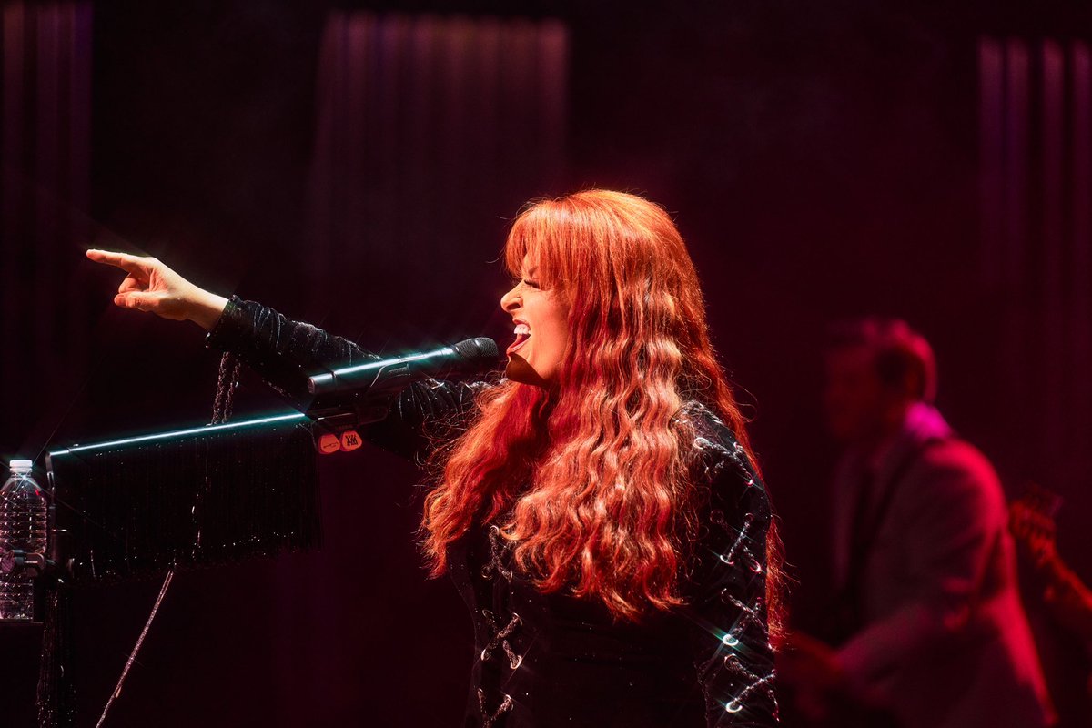 Wynonna's tweet photo. I will be honest, when we came up with the concept of touring my first 2 solo albums in full, I wasn’t sure it was going to work. That thought quickly changed as we announced the tour and watched you all rally behind these songs on social media. When we finally stepped into these beautiful venues, I had the best seat in the house as I watched you breathe life into these songs that otherwise could have been left behind. To the fans…. thank you, thank you, thank you on behalf of myself, my band and my crew for the sold out shows, the friendship bracelets, signs, vintage AND homemade t-shirts, the little surprises along the way, and most of all for reminding us why we do what we do. Believe me… “we’ll meet again, by and by.” 🫶🏼💜 Love you all…always will!