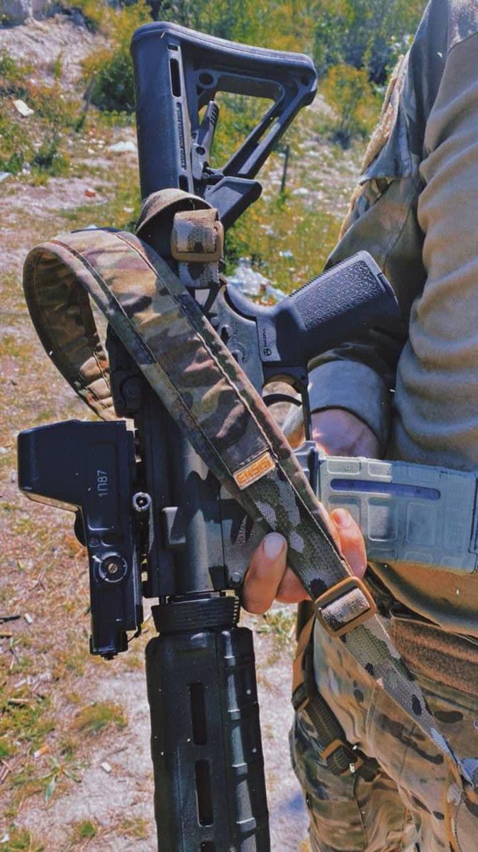 Ukrainian soldier using captured 1P87 optic on AR-15 type rifle.