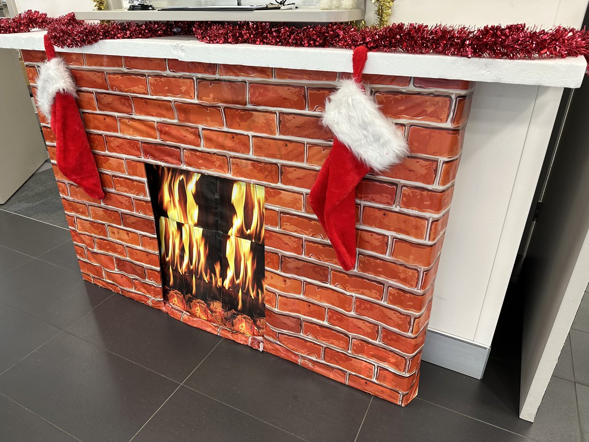For risk adverse organisations like one of mine.
The mantle piece has been constructed from re-purposed Styrofoam and it is understood that no animals were directly harmed in the production of the Santa hats.