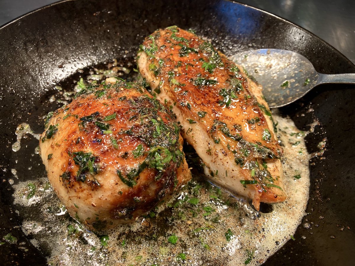 Breast and stuffed chicken thigh roasted in garlicky herby butter