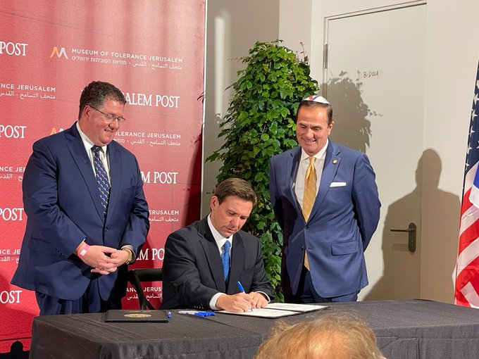 DissidentSoaps's tweet photo. This is the guy that wrote Florida's Anti-Semitism Speech Restriction bill, which Ron DeSantis signed in Israel as Randy Fine hovered over him. https://t.co/k1pIFVMUiA