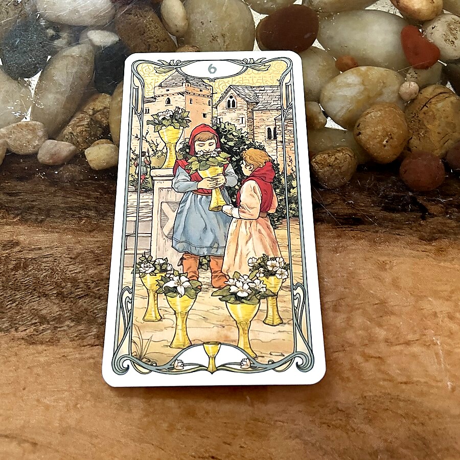The 6 of Cups embodies nostalgia and the sweetness of returning to one's roots. With innocence and joy, it invites us to revisit our past and the lessons learned from it. #Tarot #6ofCups