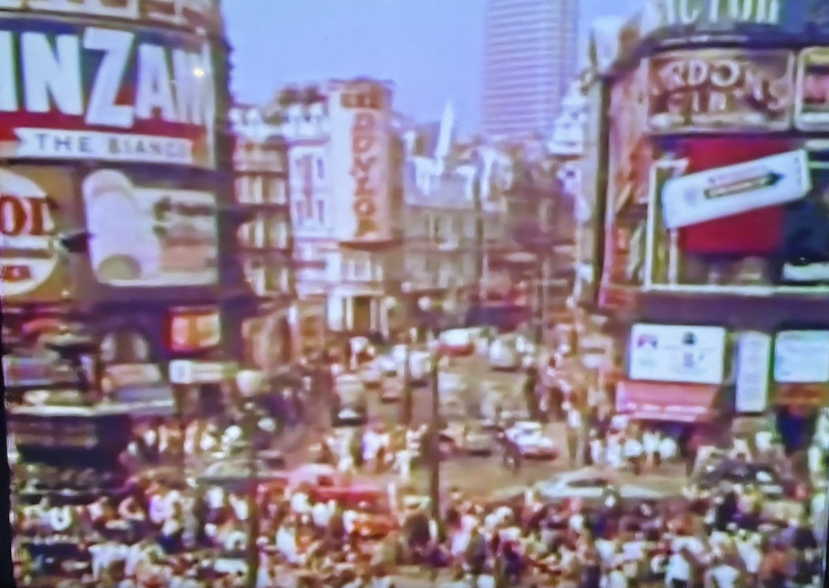 A rare restored photo of Piccadilly Circus taken December 4 1945, as news has filtered that the World War 11 had ended. 
It’s a joyous occasion as illustrated in this historical photograph.