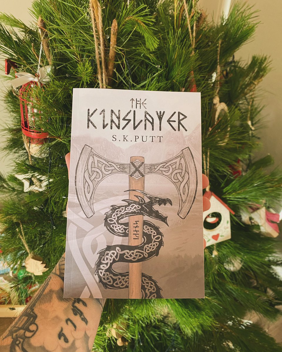 Looks good in front of the 🎄🐺🐍 #thekinslayer #vikingfantasy #aussieauthor #debutnovel #norsemythology