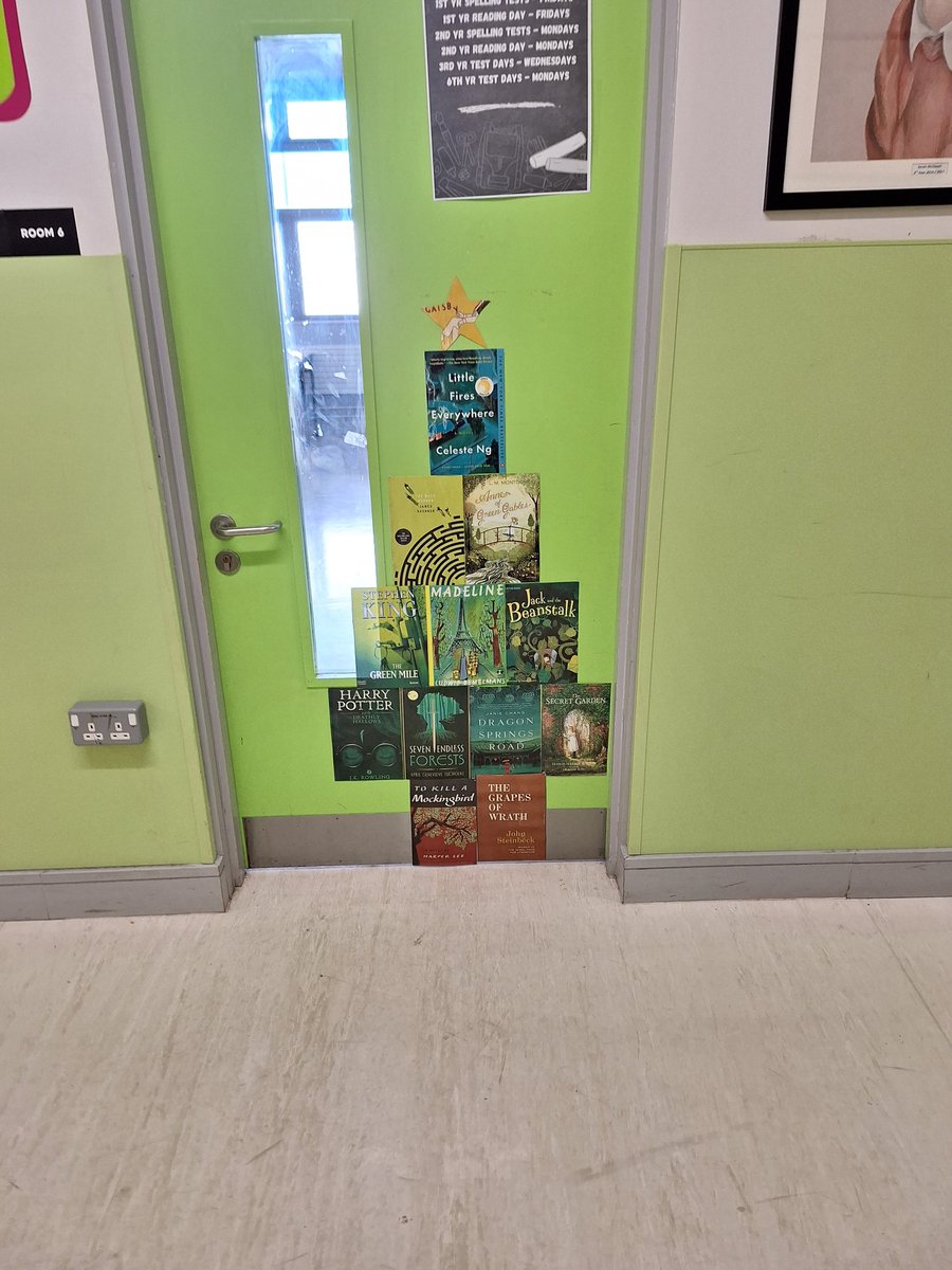 muinteoircasey's tweet photo. Book cover Christmas tree on my door in @ClaregalwayColl 📗📚 #ChristmasTree https://t.co/wlqEMcrEsL