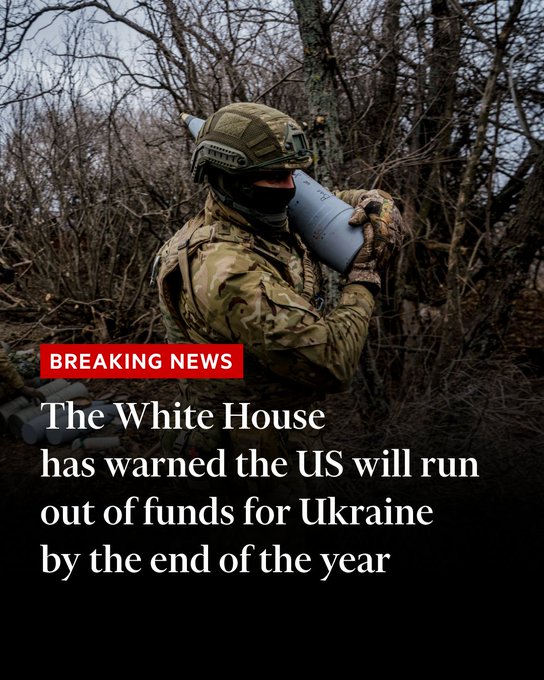 A Ukrainian serviceman carries a 152 mm shell to fire a Msta-B howitzer towards Russian positions, near the frontline town of Bakhmut on March 2, 2023, amid the Russian invasion of Ukraine. (Photo by DIMITAR DILKOFF/AFP via Getty Images). White text on image: 'The White House has warned the US will run out of funds for Ukraine by the end of the year.' 