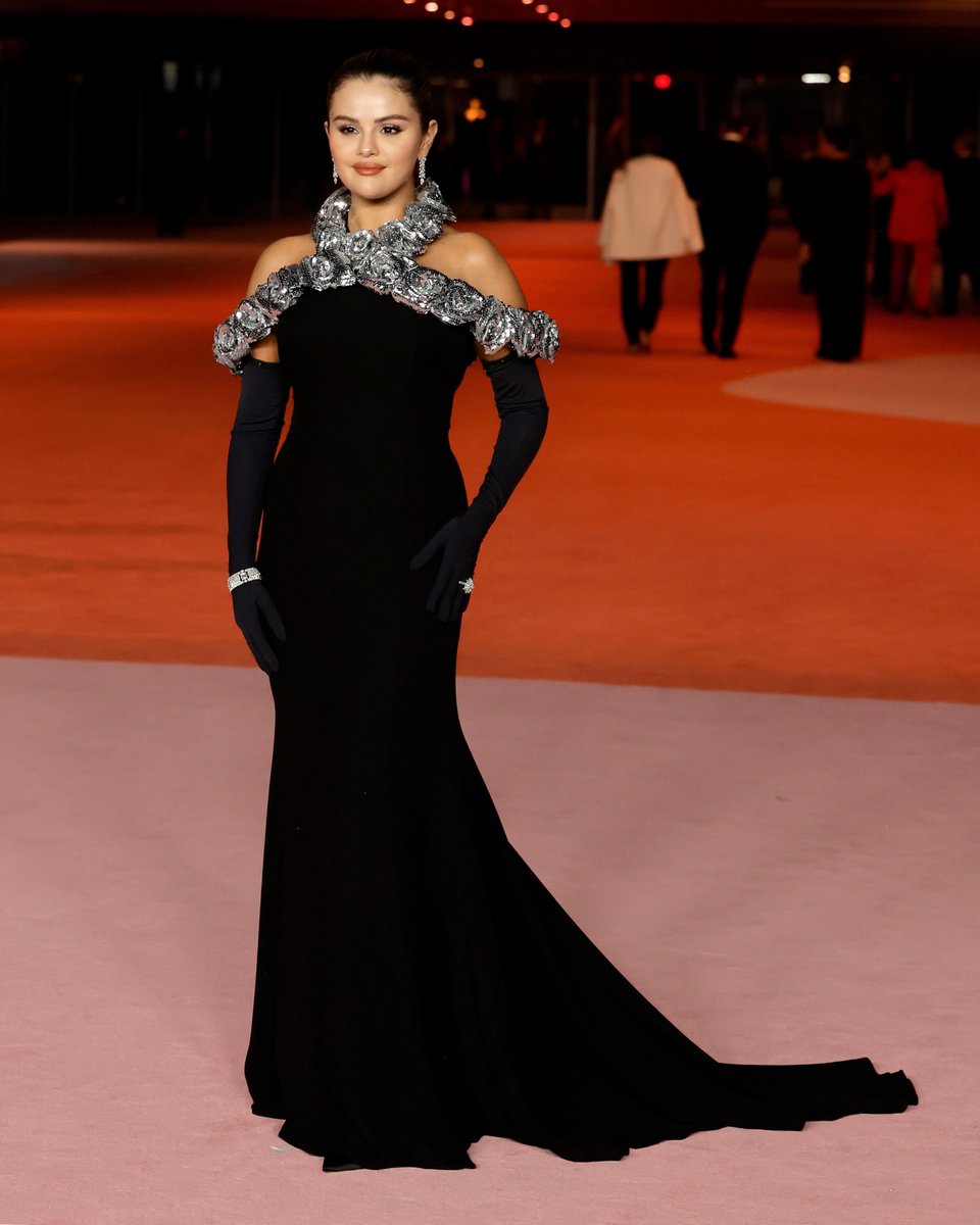 On the red carpet at this year's Academy Museum Gala, @selenagomez wore a black silk cady off the shoulder dress with combined gloves, detailed with an all over silver sequin rose embroidery on the décolleté, especially designed for her by #PierpaoloPiccioli.
Stylist: #ErinWalsh…