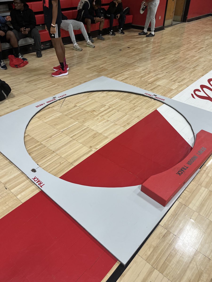 Quinlan Gray and Kylin Santamaria help deliver a refurbished and a new indoor track shot put with cart to coach Mr Nicolari