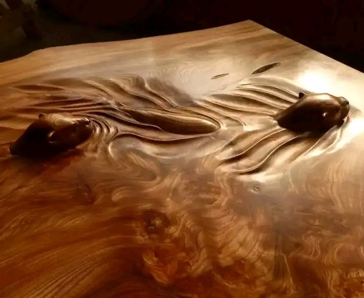 David Robinson is a self-taught, 30 year professional, who carved this amazing table surface with Otters swimming across it. He works mostly with chisels he made himself from old penknives and bits of old Land Rover spring, too. #UkraineWar#UkraineRussiaWar#SpidersInAJar
 #Yemen