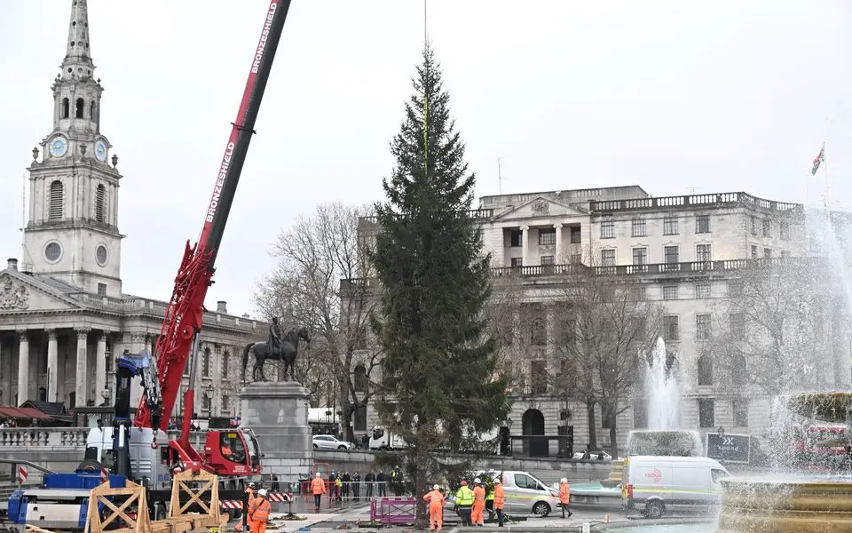 In London, as Norway’s annual gift of a Christmas tree arrives in Trafalgar Square, a spokesperson for the Treasury asks if there was any chance of just getting the cash instead