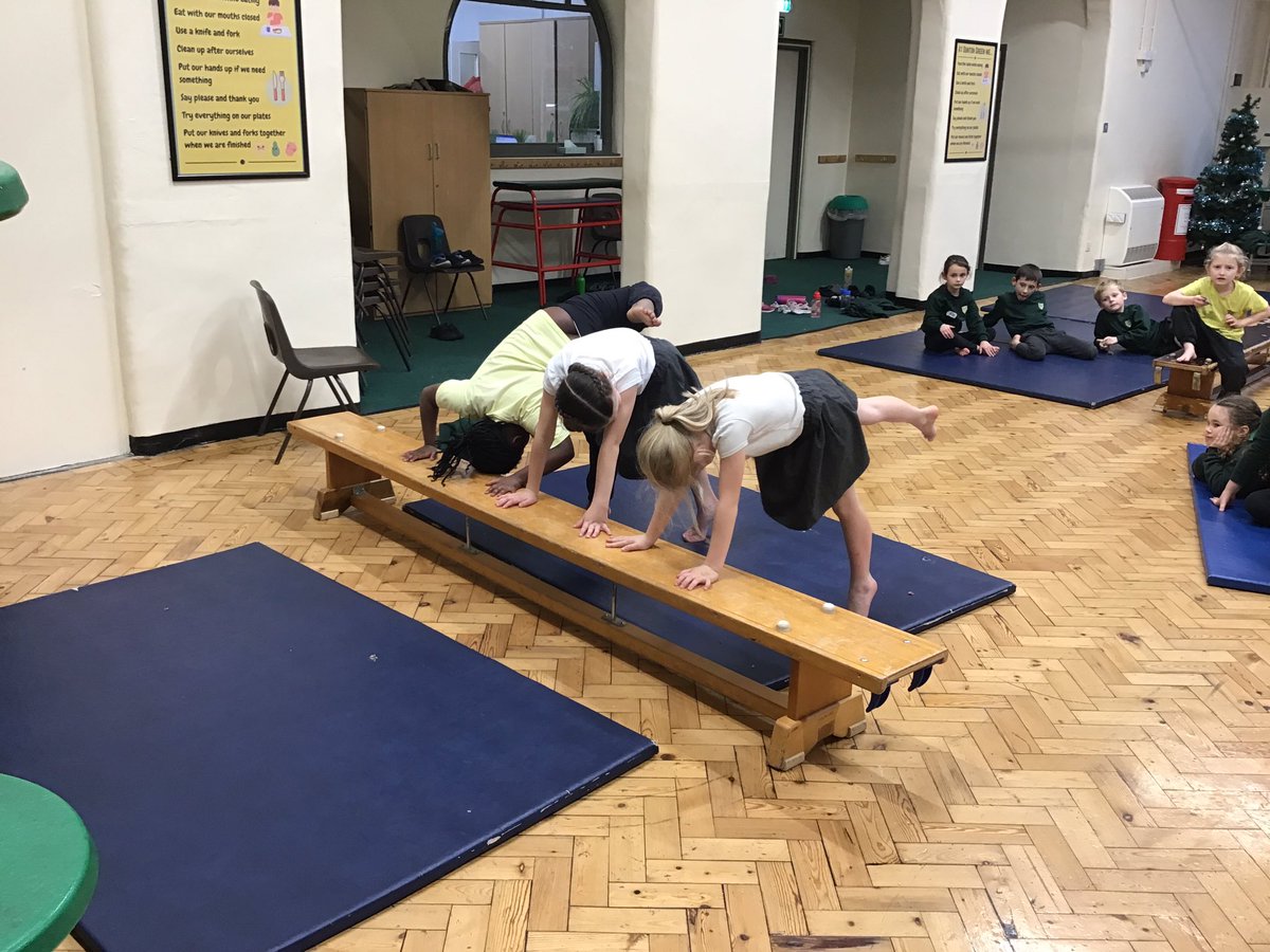 In PE today, year 2 created gymnastic sequences using mats and benches