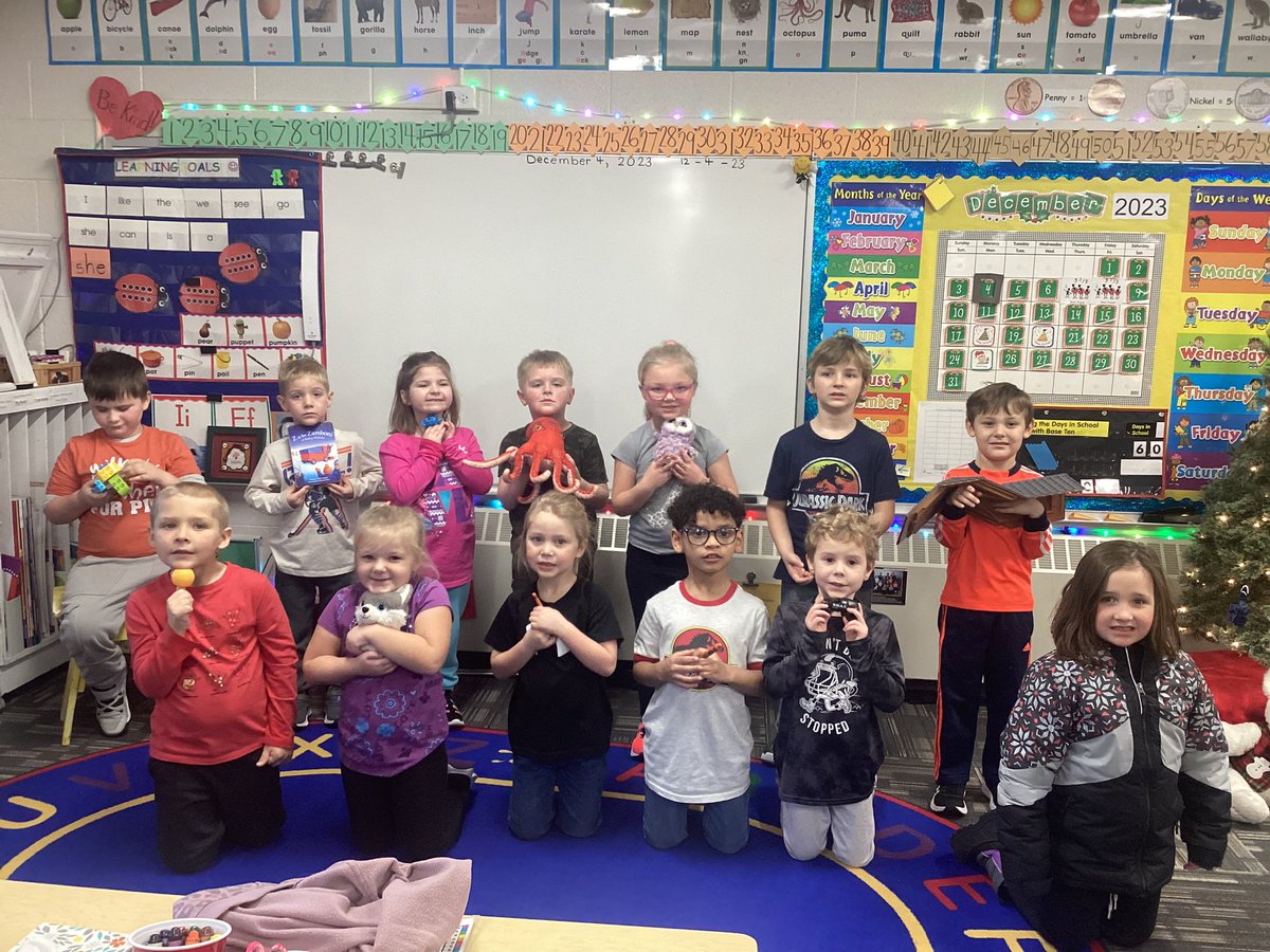 The Kinders are working on short vowel Oo at the beginning and in the middle of words this week!  We have an orange, a dog, orange crayons, a cop car, legos, a Zamboni book, an octopus, an owl, a first name, and a roof!