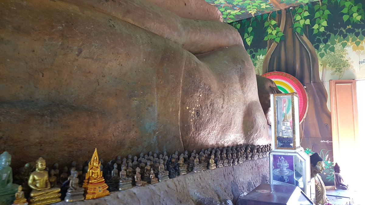 Preah Ang Thom Pagoda is a sacred temple located on Kulen Mountain in Siem Reap, Cambodia. The temple is known for its giant reclining Buddha statue, which is carved into a sandstone boulder in 16th Century and the site is a popular pilgrimage destination for the country.