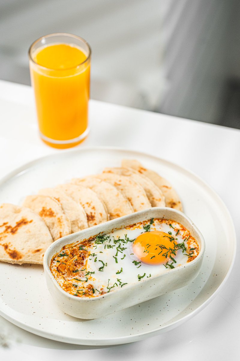 BiancoCoffeeMv's tweet photo. Kulhimas Shakshuka;
a Mediterranean-inspired shakshuka with a local twist, featuring spiced tuna in a tomato paste and spice blend, topped with a baked egg. Served with flatbread, your choice of tea, or fresh fruit juice.

#darkbrewslightbites 
#biancocoffeemv https://t.co/E2iARxb8UD