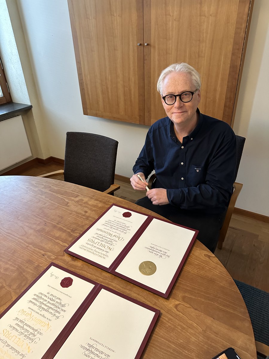 Soon ready for delivery: Nobel Assembly chair Christer Höög signing the 2023 Medicine Nobel Prize diplomas.