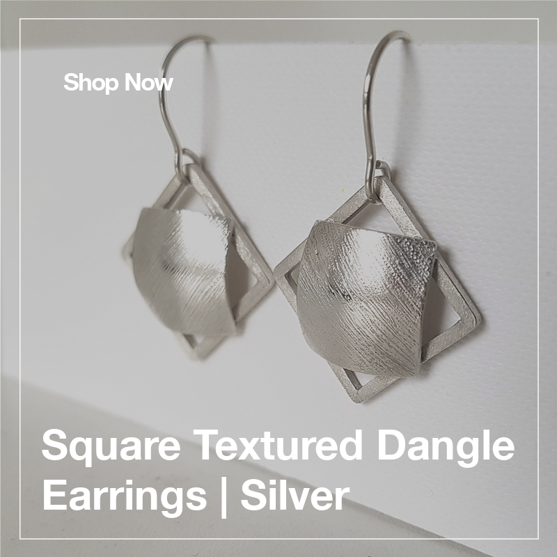 Add a touch of elegance to your look with these handmade silver dangle earrings. Shop now at wix.to/w8TJd5L 💎 #HandmadeJewelry #SilverEarrings