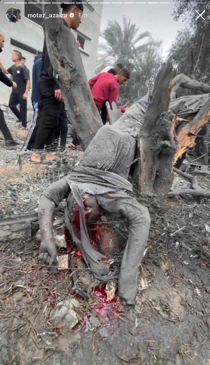 dancohen3000's tweet photo. The latest images documented by @azaizamotaz9 of a massacre of his family and neighbors in Khan Younis are just unreal. This poor soul was blown by a bomb blast onto a tree. https://t.co/xiinE0Y5ZD