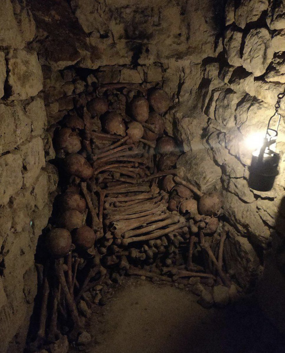 Bone throne in the Paris Catacombs. The catacombs of Paris hold the remains of an estimated 6 million people.