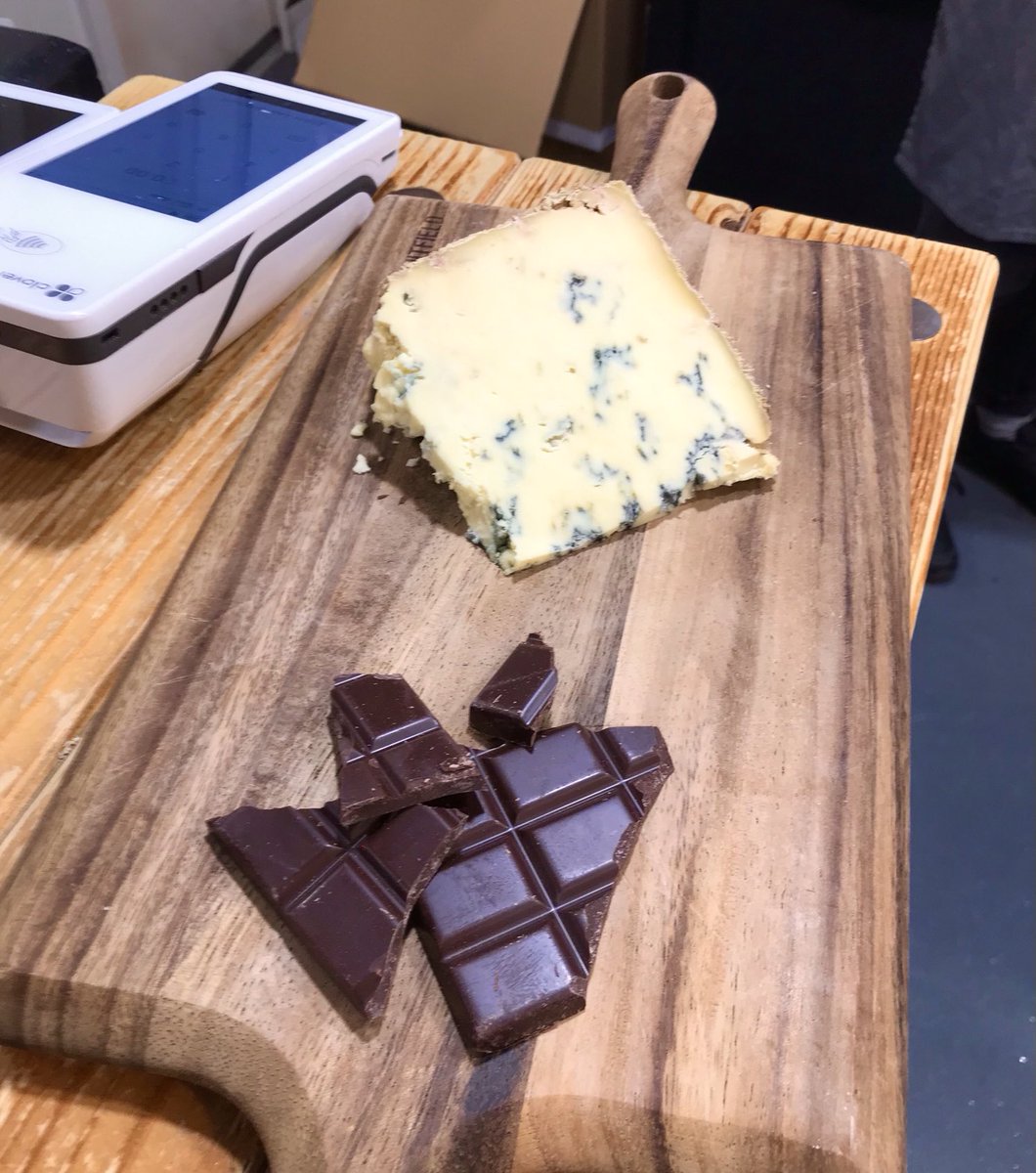 In ⁦@paxtonscheese⁩ to discuss Xmas - and they sell ⁦@bareboneschoc⁩ . Talked with lovely staff about cheese n’ choc combos… and they broke open a bar, brought out the Stilton and we had an impromptu tasting. Yes it does work: rich choc & salty cheese. A joy!