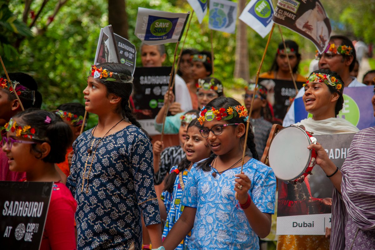 ishafoundation's tweet photo. Students of Isha Home School 🏫 took over the pathways at Isha Yoga Center, Coimbatore with a mesmerizing display of drumming sounds 🥁 to raise awareness for #WorldSoilDay. You can support Soil too 👉 tweet using #SoilForClimateAction! 🌱🌏