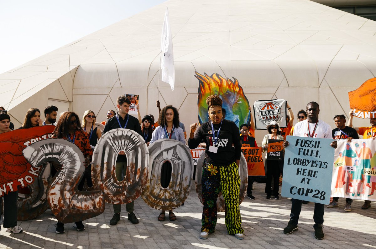 CANIntl's tweet photo. 📸 At the #COP28 entrance this morning, we stood together with a clear message — we must #KickBigPolluters out of the @UNFCCC climate negotiations. 

At least 2400 fossil fuel lobbyists are at COP28, poisoning this process from the inside. #EndFossilFuels https://t.co/U6GSQdGMwi