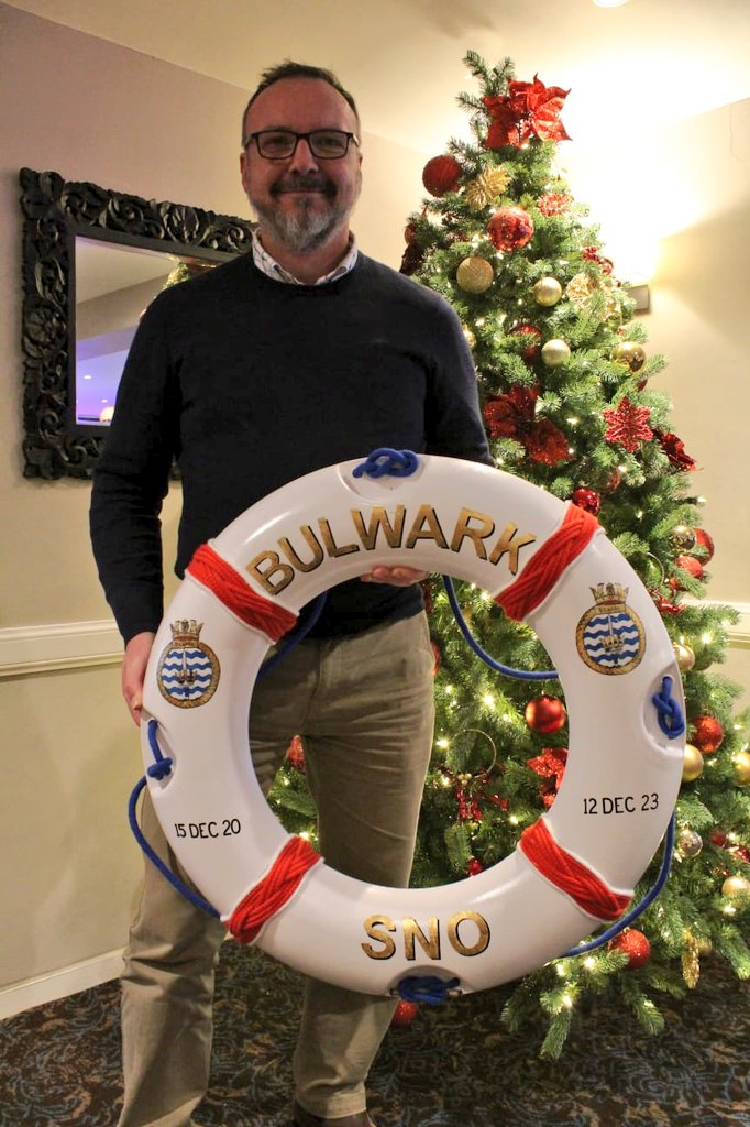 HMSBulwark's tweet photo. The last duty of our Senior Naval Officer (SNO) before he departs was to chair an informal 'Christmas' Heads of Department (CHoDs) meeting @ChinaFleet Club in #Saltash. We took the opportunity to thank him for his hard over his 3 year tenure and present him with a leaving gift. https://t.co/tY1NCfJ0ka